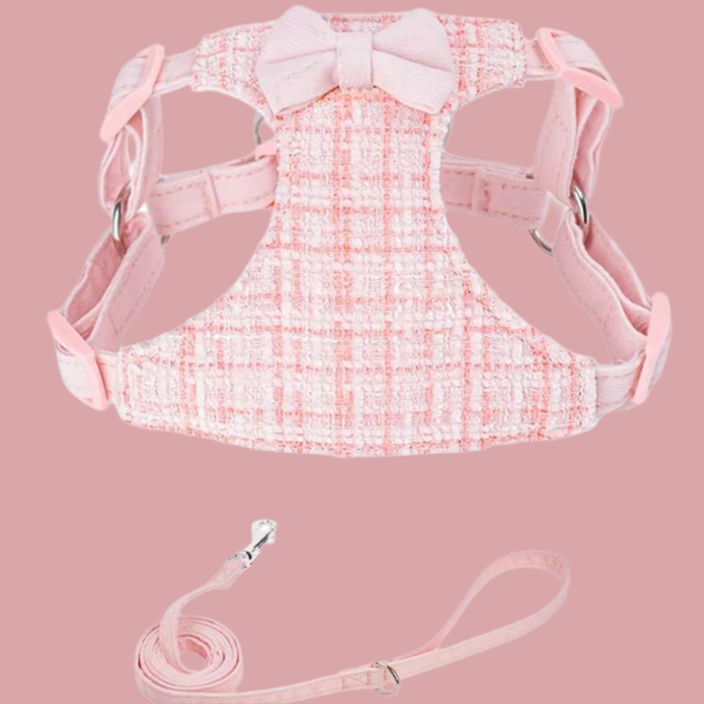 Pink plaid tweed dog harness with a matching pink bow tie and leash, displayed on a white background.