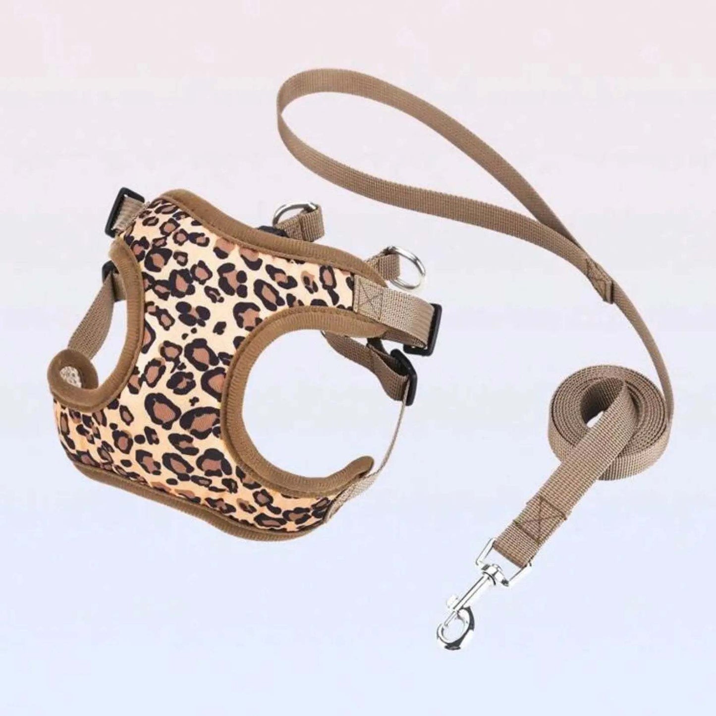 Brown leopard print dog harness and matching brown leash set on a light background.