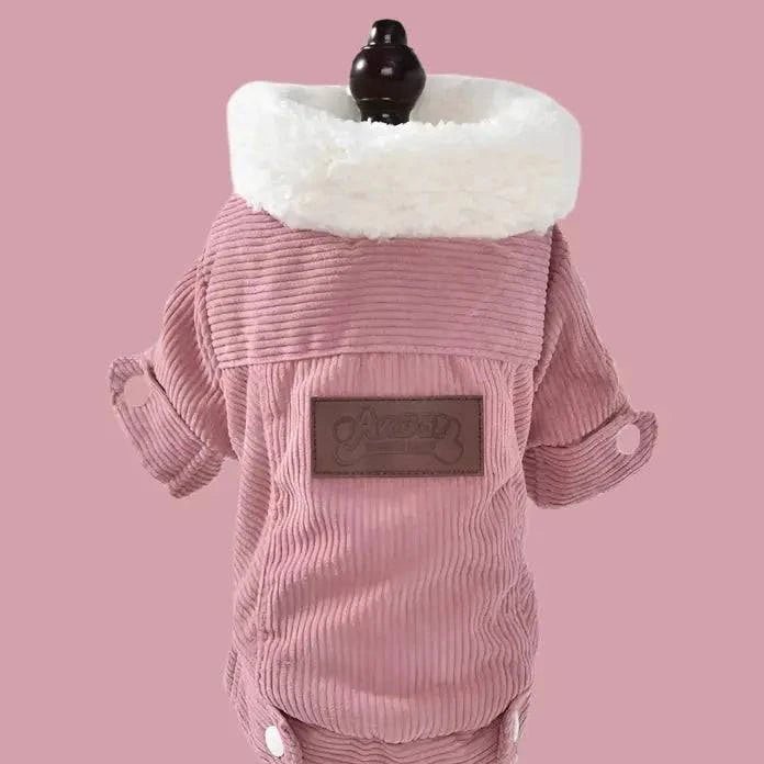 Pink corduroy dog jacket with white fleece collar and brown patch, shown on a mannequin against a pink background.