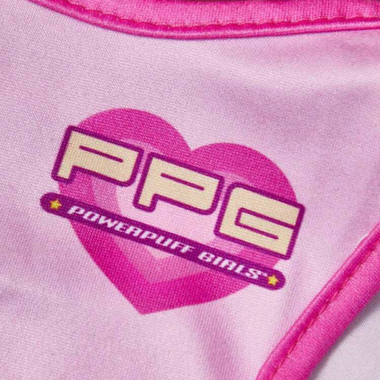 Close-up of a pink dog shirt showing the "PPG Powerpuff Girls" logo inside a pink heart.