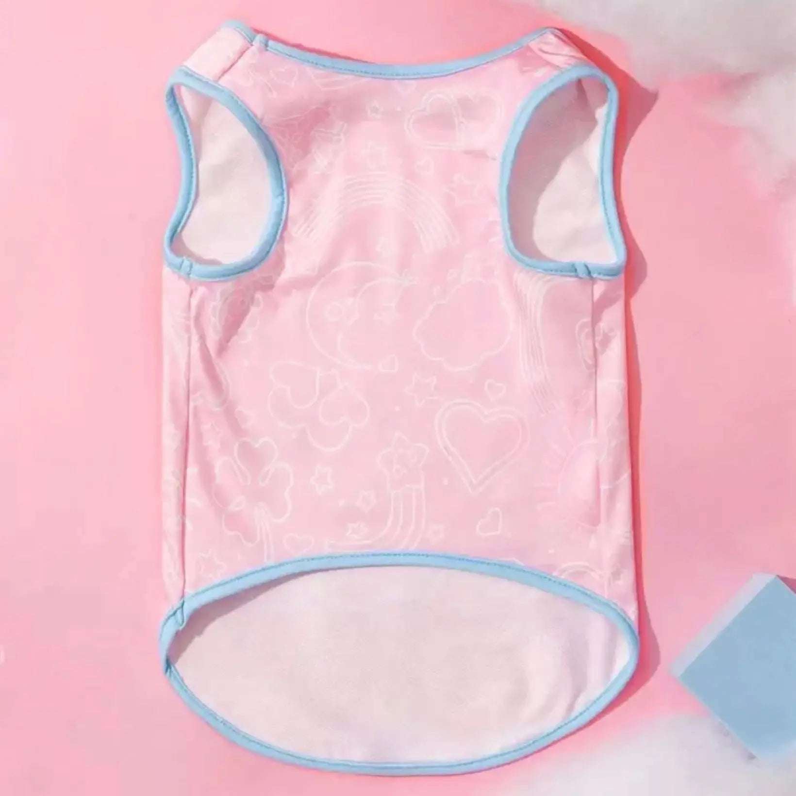 Back view of a pink Care Bears dog tank top with blue trim, showing the full shape and subtle background pattern.